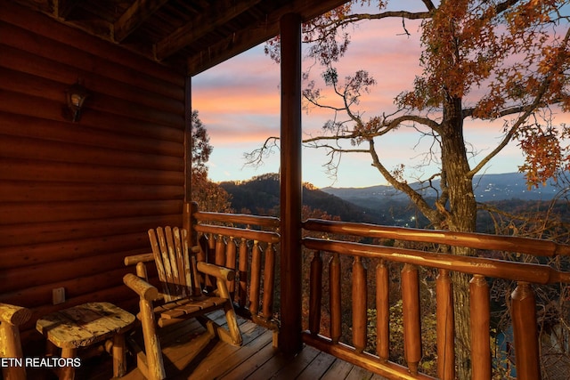 deck at dusk with a mountain view