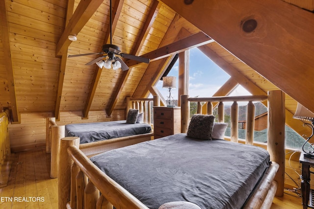 bedroom with vaulted ceiling with beams, ceiling fan, light wood-type flooring, and wood ceiling