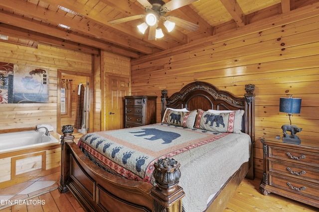 1707 High Rock Way, Sevierville, TN 37862 - bedroom featuring wooden walls, wooden ceiling with exposed beams, light wood-style floors, and a ceiling fan
