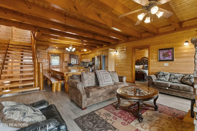1707 High Rock Way, Sevierville, TN 37862 - living room featuring wooden ceiling with exposed beams, wooden walls, light wood finished floors, ceiling fan, and stairway