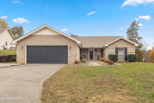 single story home featuring a garage and a front lawn