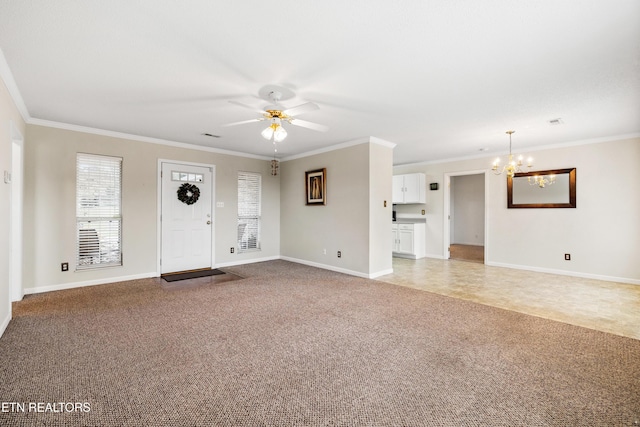 unfurnished living room featuring ceiling fan with notable chandelier, carpet floors, and crown molding