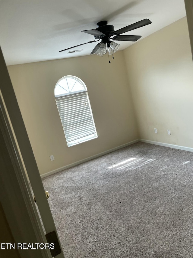 carpeted empty room with ceiling fan