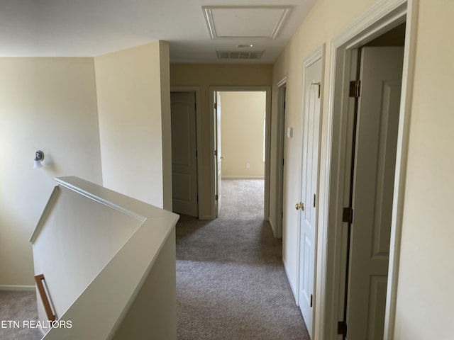 corridor with carpet floors