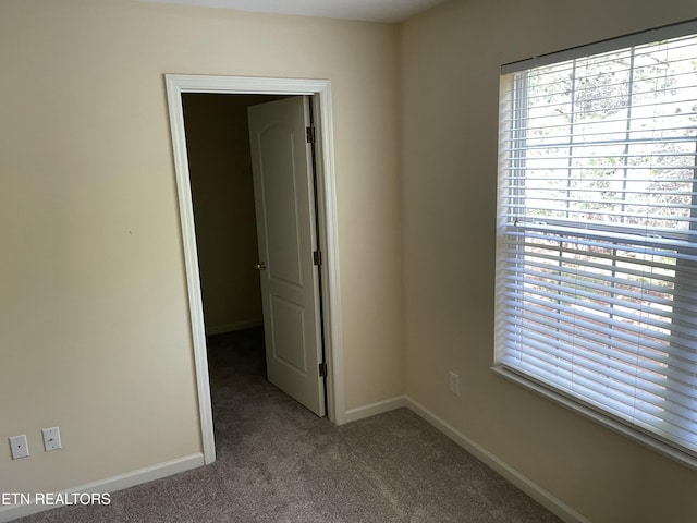 spare room with carpet flooring