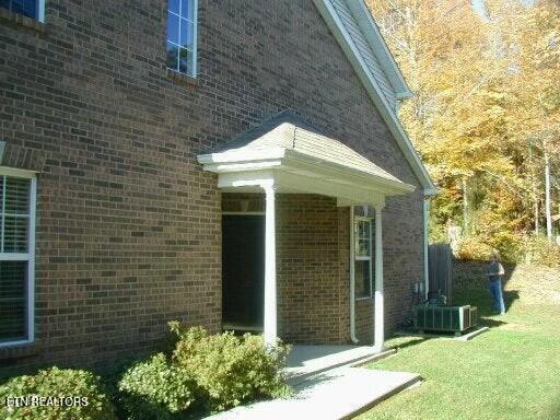 view of home's exterior featuring a yard and central air condition unit