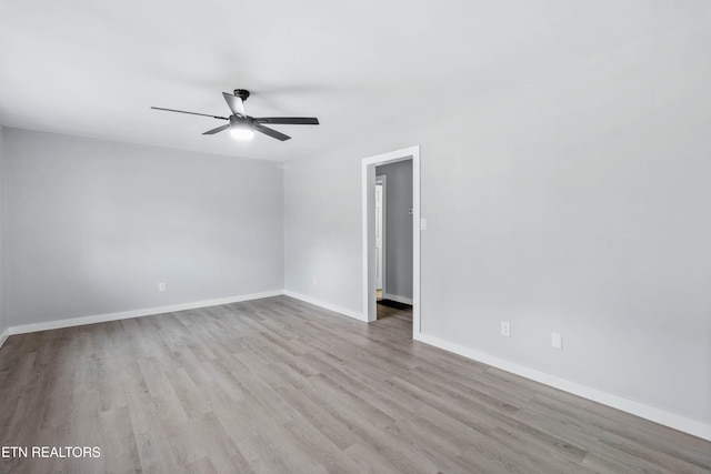 unfurnished room featuring light hardwood / wood-style floors and ceiling fan