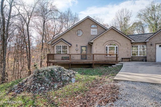 view of front of property featuring a garage and a deck