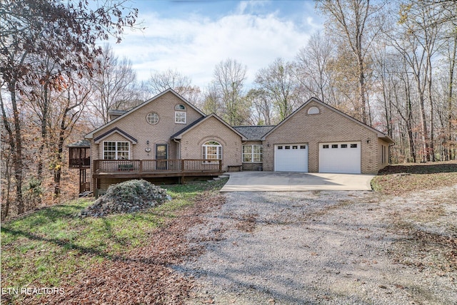 view of front of house with a wooden deck and a garage