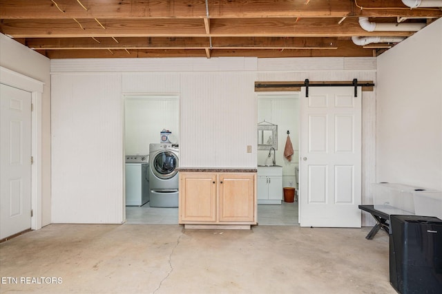 laundry room featuring a barn door