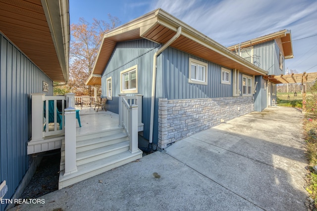 view of side of property with a deck