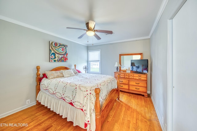 bedroom featuring wood-type flooring, ceiling fan, and crown molding