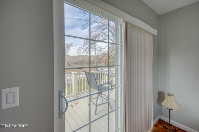 doorway with hardwood / wood-style floors