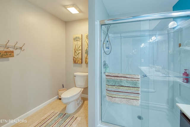 bathroom with tile patterned floors, a shower with door, and toilet