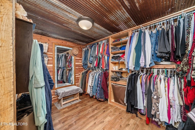 spacious closet featuring light hardwood / wood-style floors