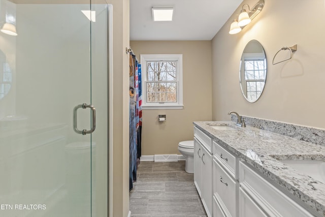 bathroom with hardwood / wood-style flooring, vanity, toilet, and a shower with shower curtain