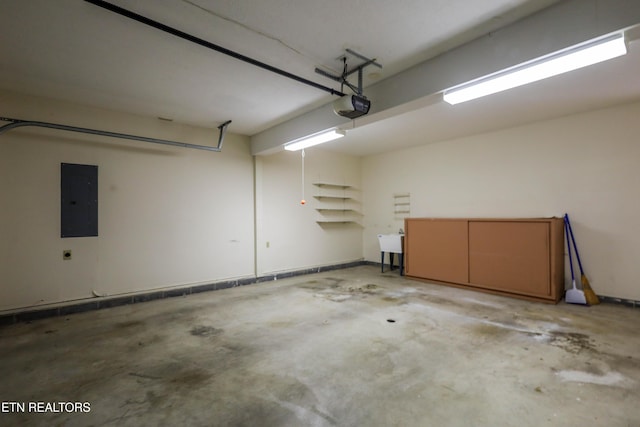 garage featuring electric panel and a garage door opener