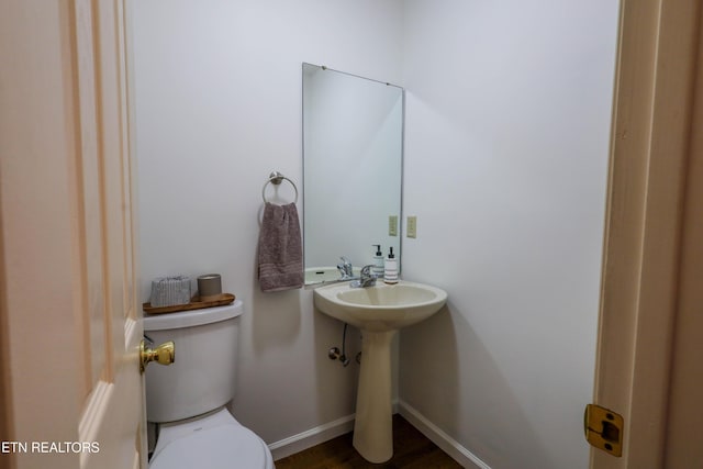 bathroom with toilet and sink