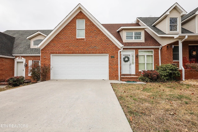 view of front facade with a garage and a front yard