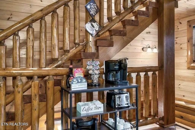 interior space featuring wooden ceiling and wooden walls