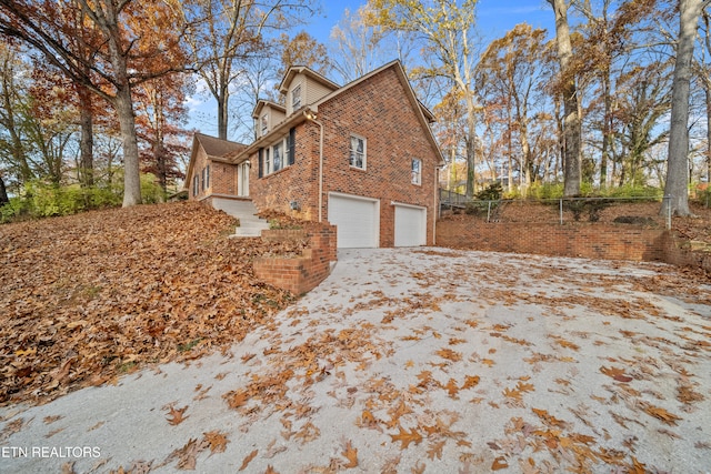 view of side of home with a garage