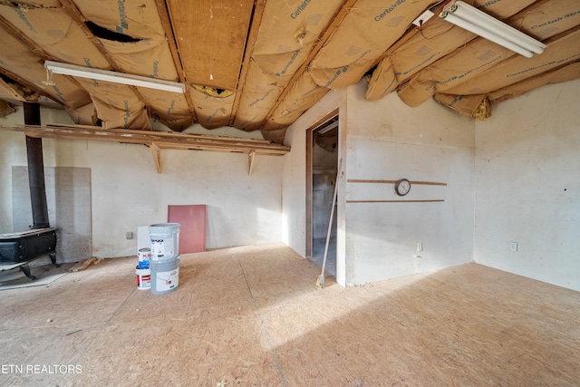 basement featuring a wood stove