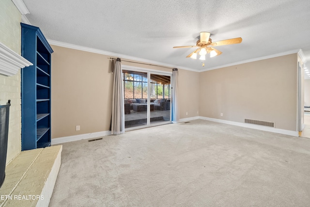 unfurnished living room with ornamental molding, a brick fireplace, and carpet