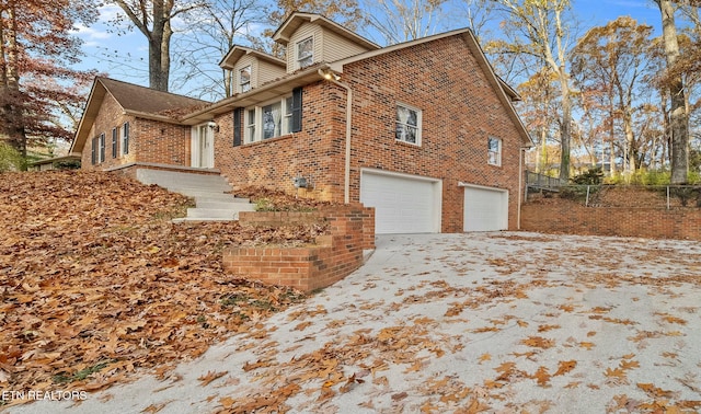 view of property exterior with a garage