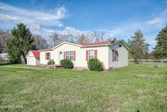 view of front of property with a front yard and an outdoor structure