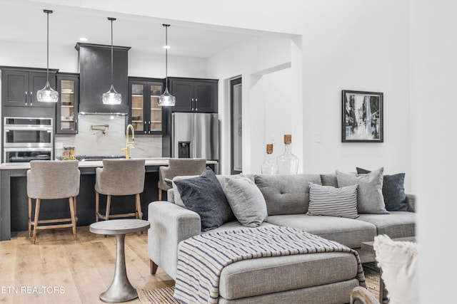 living room with light hardwood / wood-style flooring