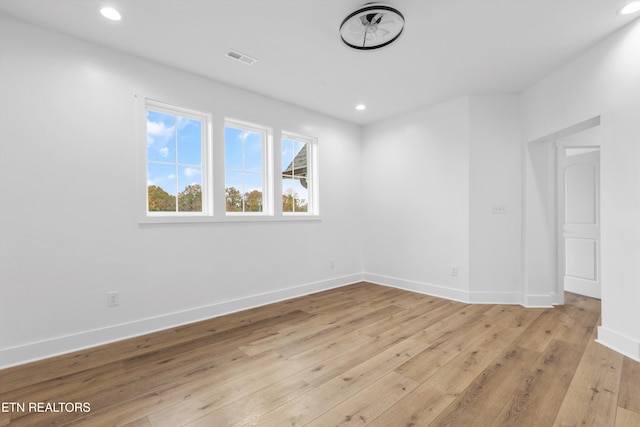 spare room featuring light hardwood / wood-style flooring