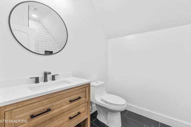 bathroom with tile patterned floors, vanity, and toilet