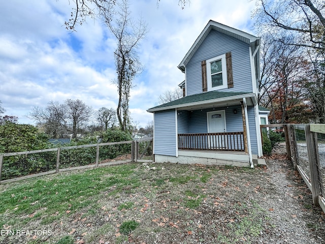 view of home's exterior with covered porch