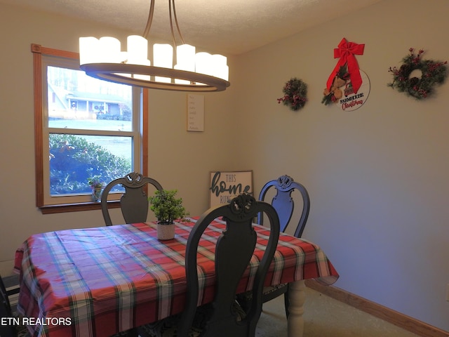 view of carpeted dining space