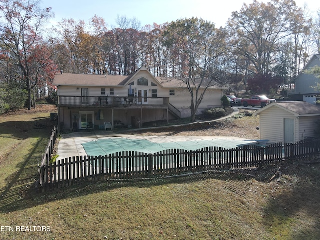 view of swimming pool with a patio area, a yard, and a deck