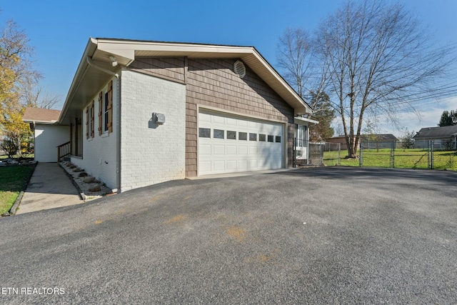 view of side of home featuring a garage