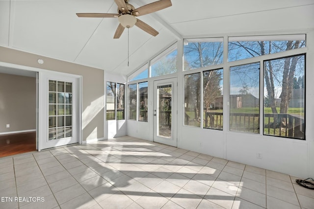 unfurnished sunroom featuring lofted ceiling with beams and ceiling fan