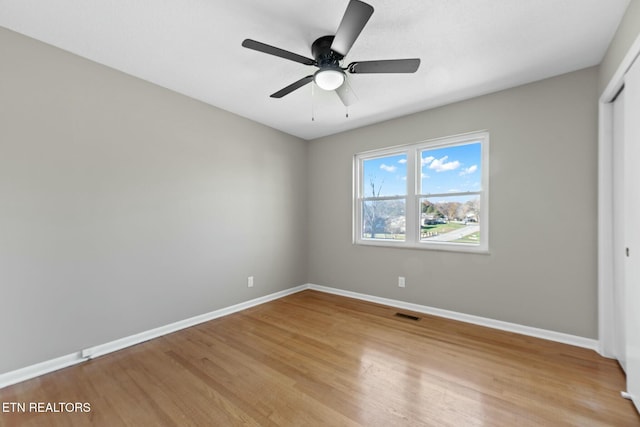 unfurnished bedroom featuring a closet, ceiling fan, and light hardwood / wood-style flooring