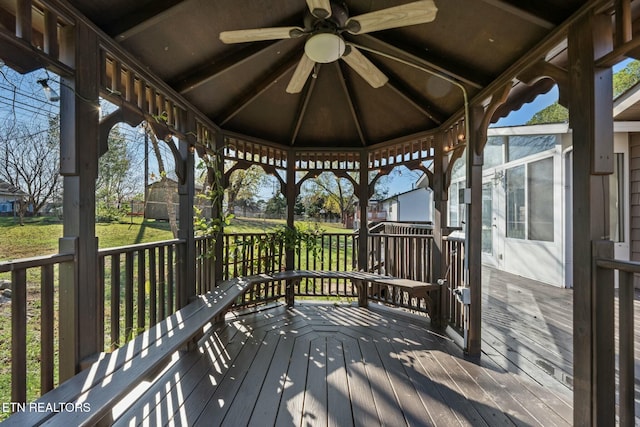 deck with a gazebo and ceiling fan