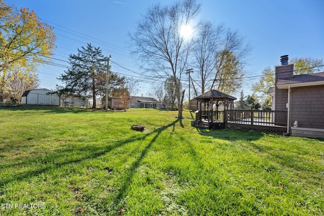 view of yard with a gazebo and a deck