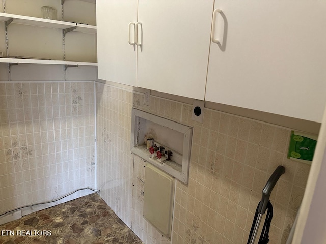 bathroom with tile walls