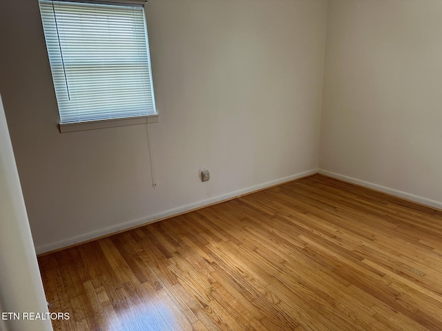 spare room featuring light hardwood / wood-style floors