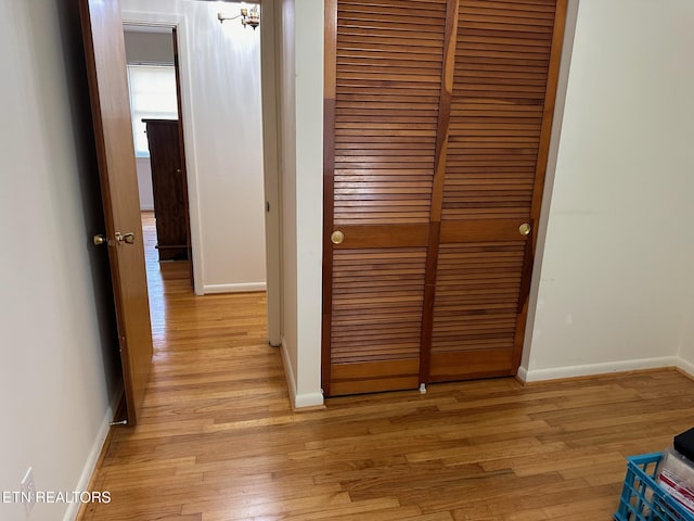 hallway with light wood-type flooring