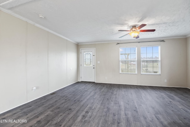 unfurnished room with a textured ceiling, dark hardwood / wood-style flooring, and crown molding