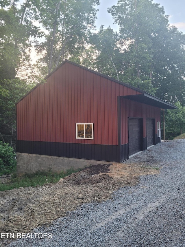 outdoor structure at dusk with a garage