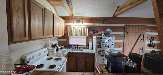 kitchen with white appliances, sink, a textured ceiling, beamed ceiling, and light stone counters