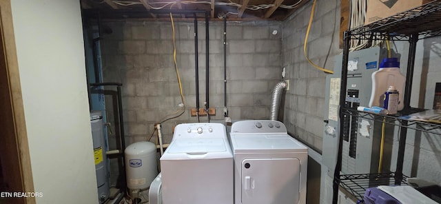 washroom featuring independent washer and dryer and electric water heater