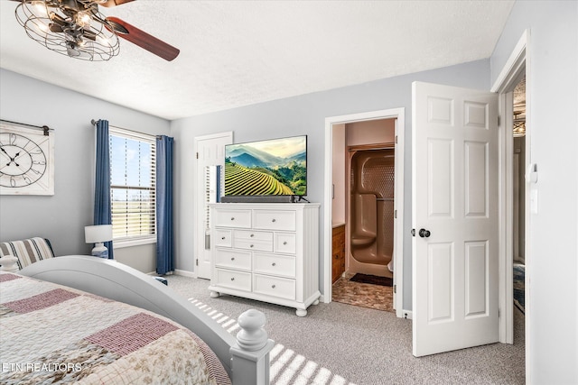 bedroom featuring light carpet, a textured ceiling, and ceiling fan