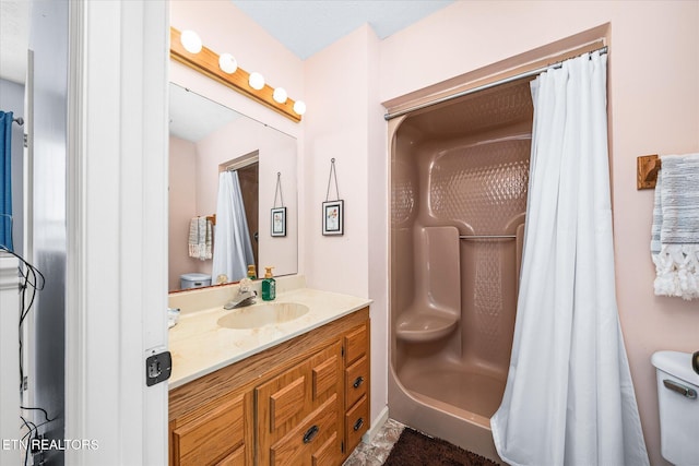 bathroom with vanity and curtained shower