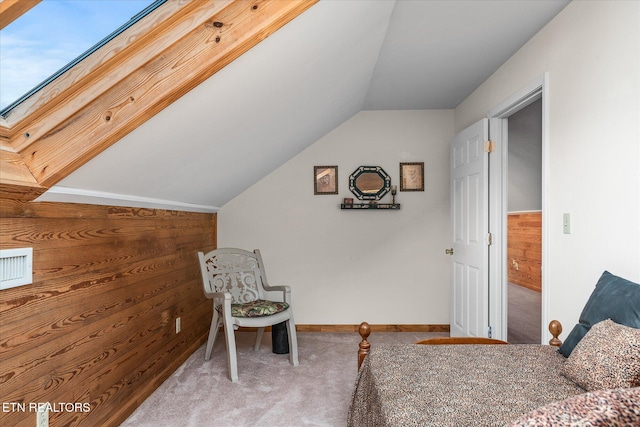 carpeted bedroom with lofted ceiling